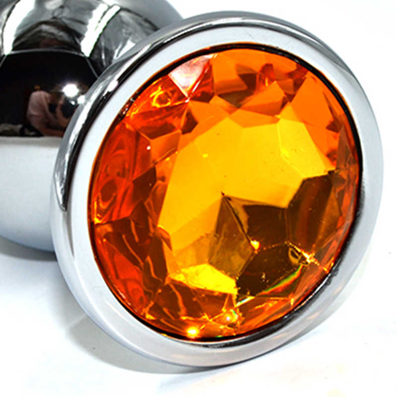 Крупная анальная пробка  KANIKULE с желтым кристаллом, серебристая, 10х4,6 см